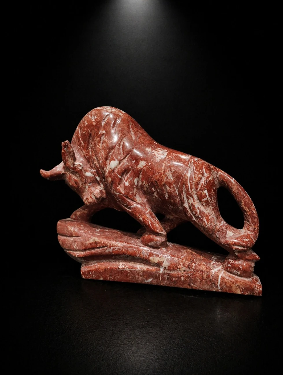 Charging bull sculpture